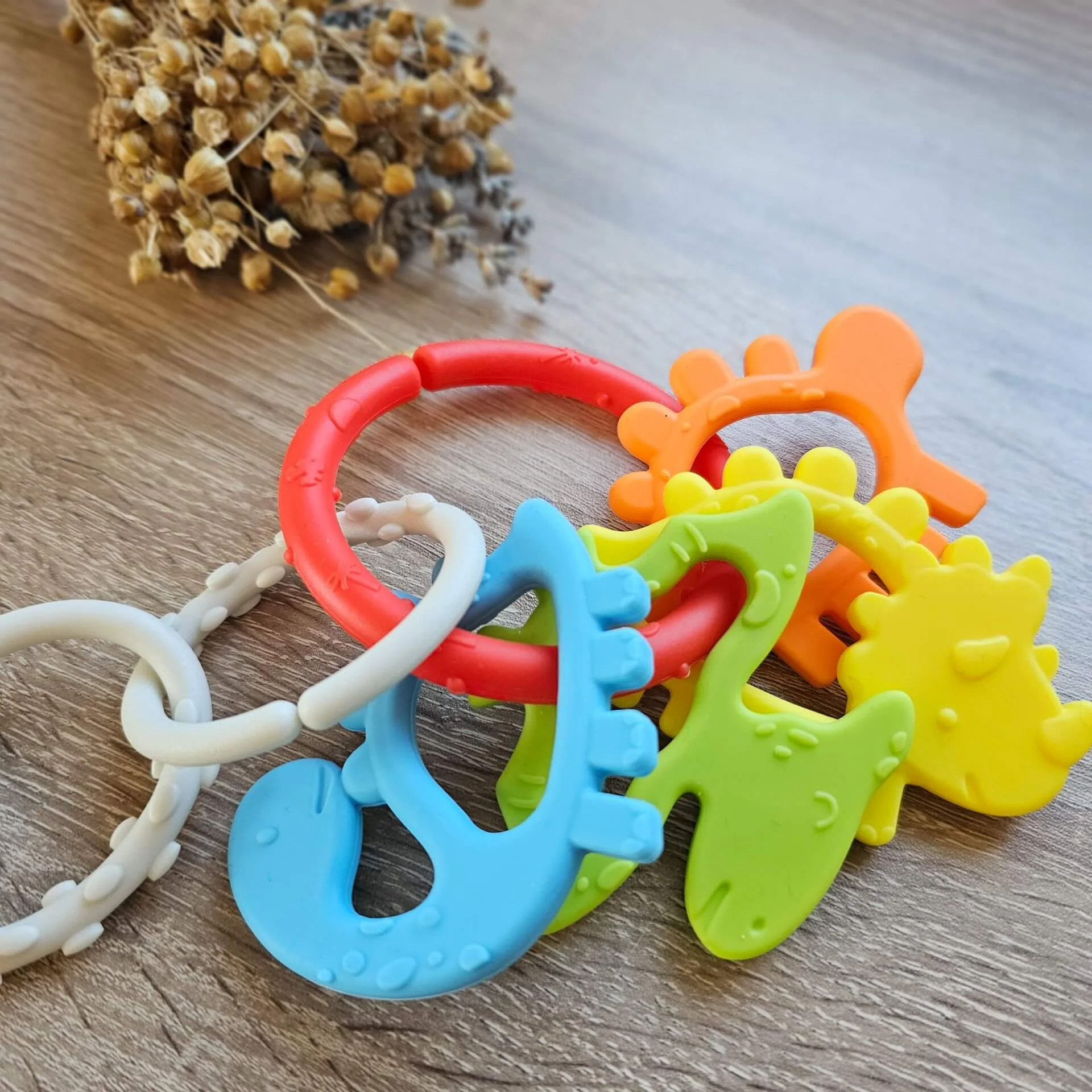 Greifling Dino "bunt" — Millhouse Lernspielzeug Schule